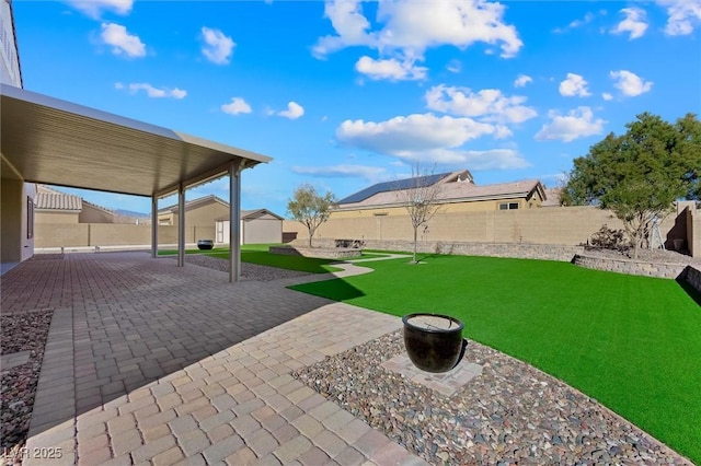 view of yard with a patio area