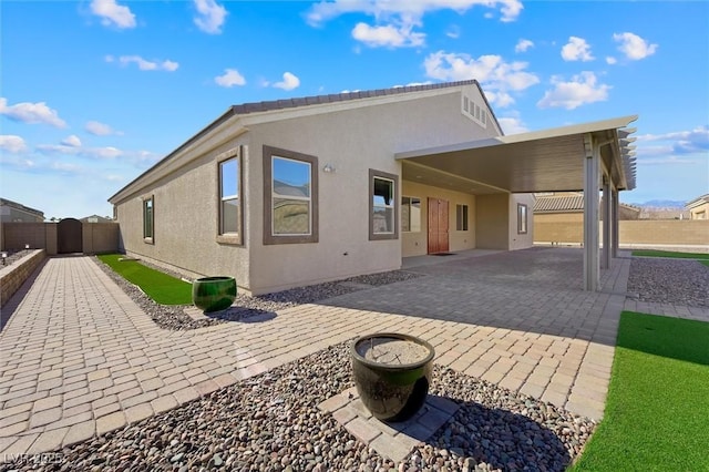 rear view of house with a carport