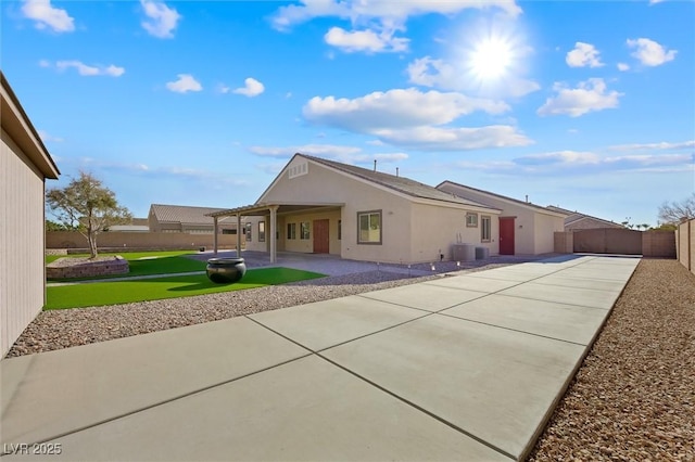 back of property featuring central AC unit and a patio area