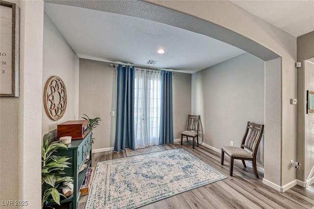 living area featuring hardwood / wood-style floors