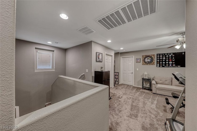 office area with ceiling fan and light colored carpet