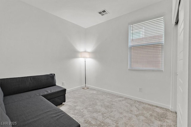 living area with light carpet