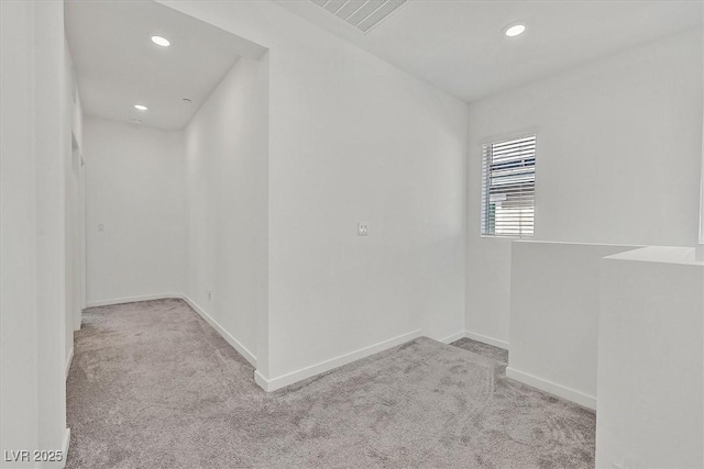 empty room featuring light colored carpet