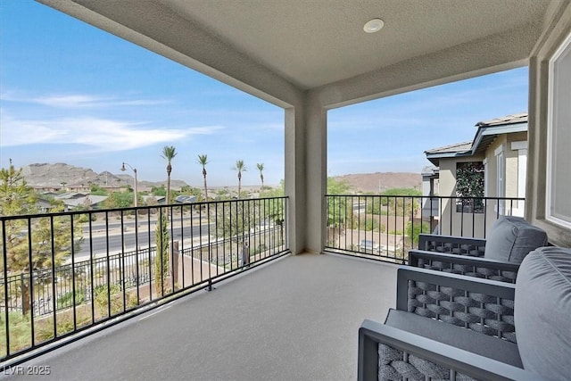 balcony featuring a mountain view