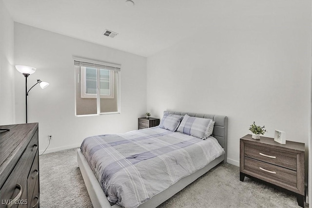 bedroom featuring light colored carpet