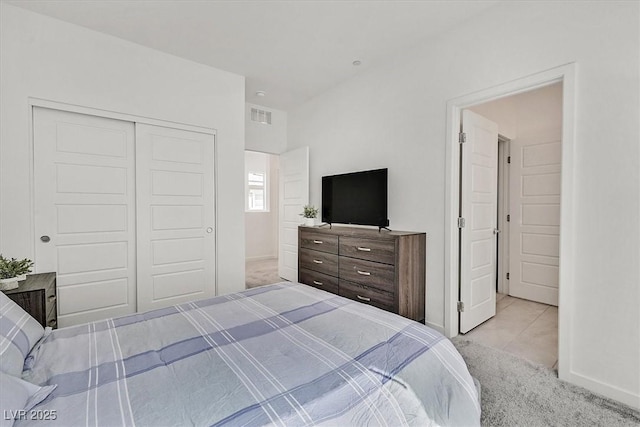 carpeted bedroom featuring a closet