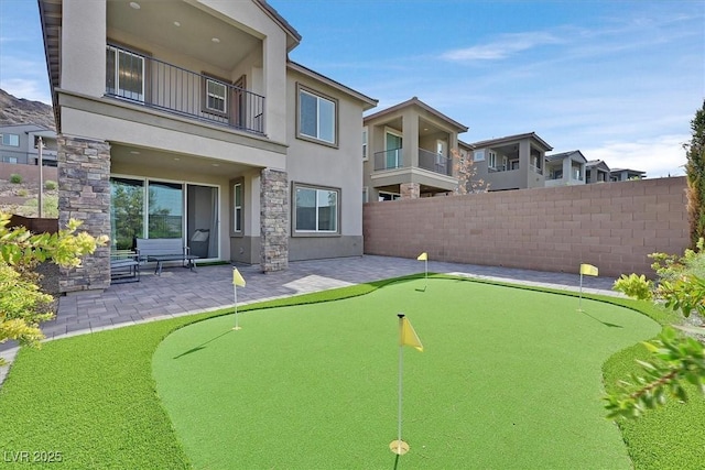 view of community with a patio area