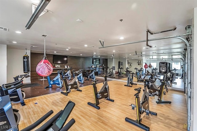 workout area featuring hardwood / wood-style flooring