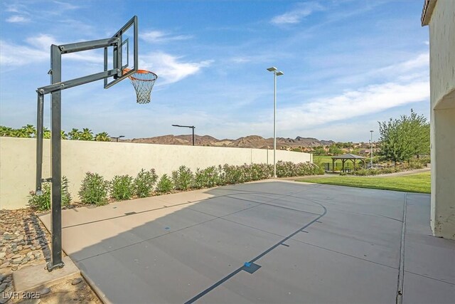 view of basketball court featuring a mountain view