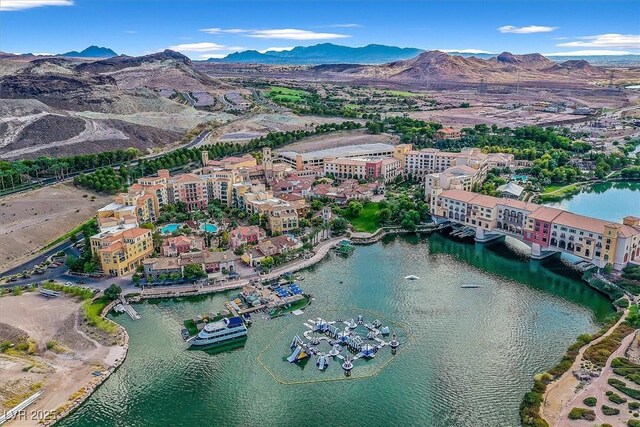 bird's eye view with a water and mountain view