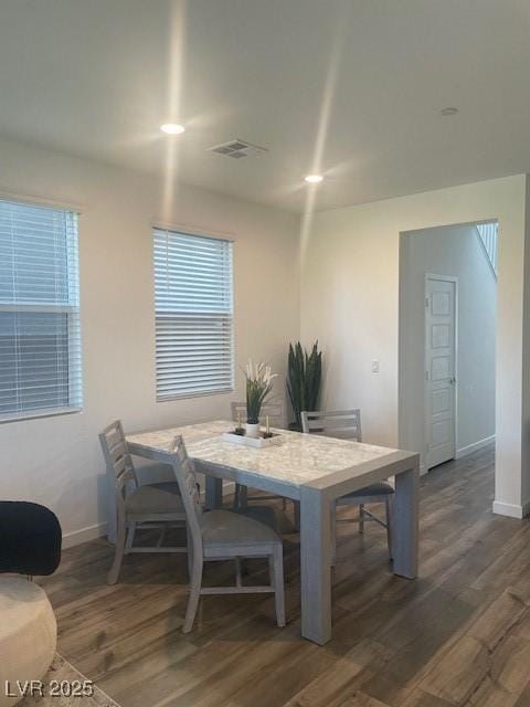 dining room featuring dark hardwood / wood-style flooring