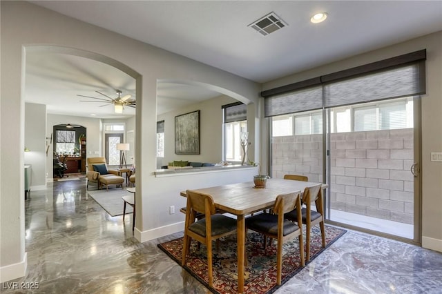 dining space with ceiling fan