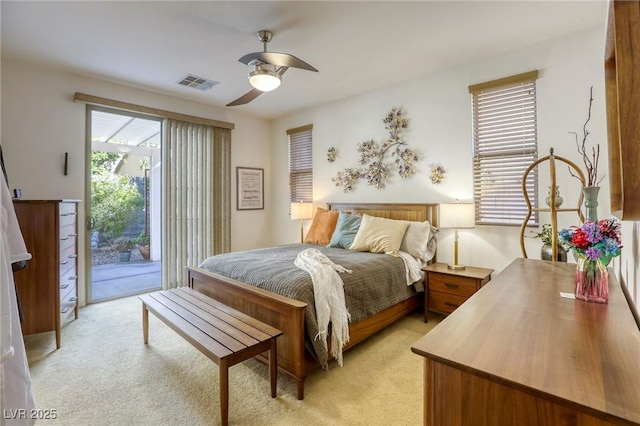 bedroom with ceiling fan, access to outside, and light carpet