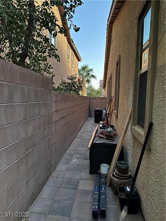 view of side of home with a patio area