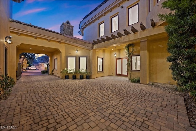 exterior space with decorative driveway