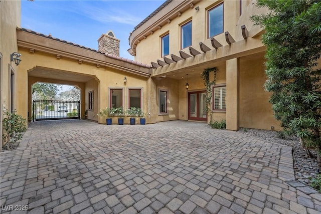 10923 Willow Heights Dr, Las Vegas, NV 89135 - view of patio featuring a gate and decorative driveway