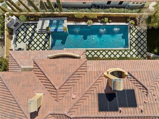 view of swimming pool featuring a fenced in pool