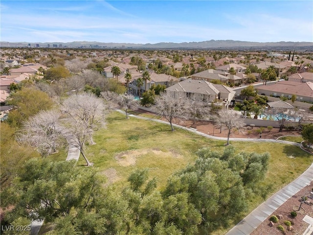 birds eye view of property with a mountain view and a residential view