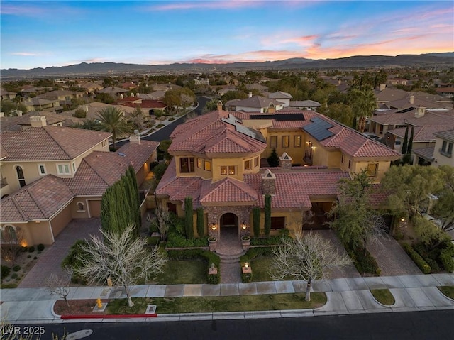 aerial view featuring a residential view and a mountain view