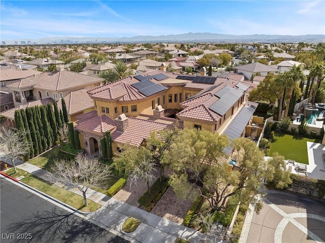 birds eye view of property with a residential view and a mountain view