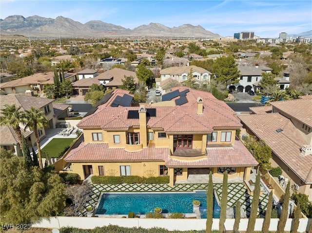 drone / aerial view featuring a residential view and a mountain view