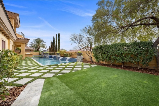 view of yard with a patio area, a fenced backyard, and an outdoor pool