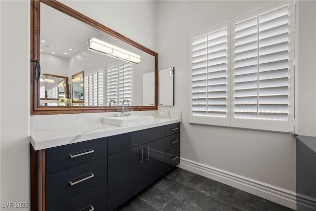 10923 Willow Heights Dr, Las Vegas, NV 89135 - bathroom with vanity, baseboards, and marble finish floors
