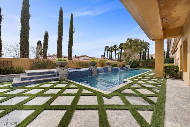 view of pool featuring an in ground hot tub, a patio area, a fenced backyard, and a fenced in pool