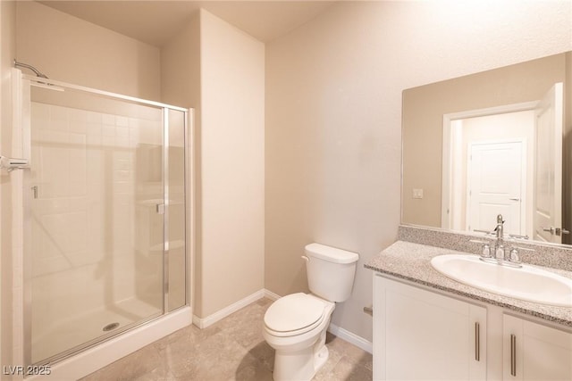 bathroom with toilet, a shower with shower door, and vanity