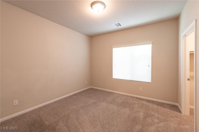 view of carpeted spare room