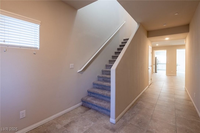 stairway featuring tile patterned floors