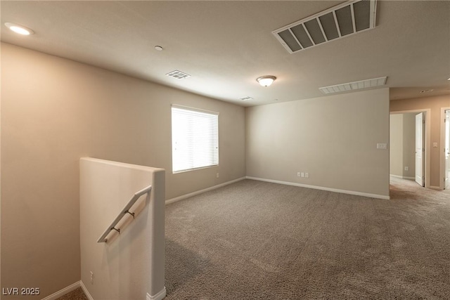 unfurnished room with carpet floors