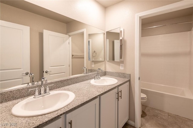 full bathroom with toilet, vanity, and shower / bathing tub combination