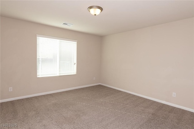 unfurnished room with carpet floors