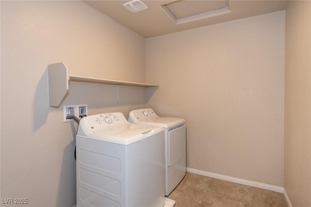 washroom with washing machine and clothes dryer