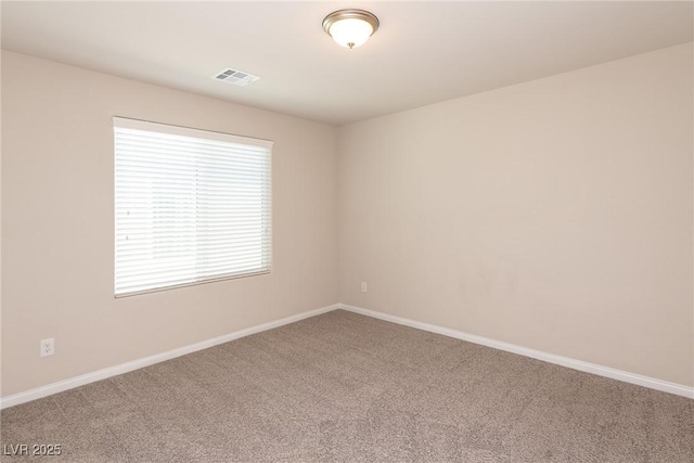 spare room featuring carpet flooring