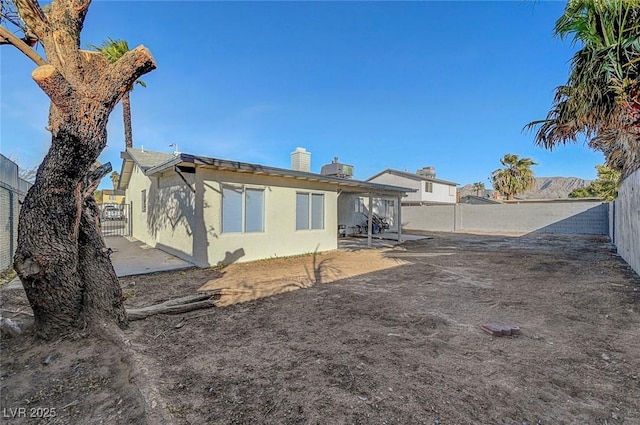 back of property with a patio area