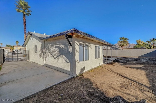 view of home's exterior with a patio