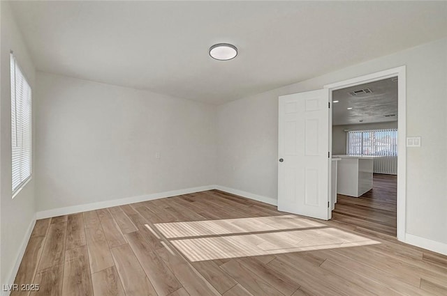 unfurnished room featuring light hardwood / wood-style floors