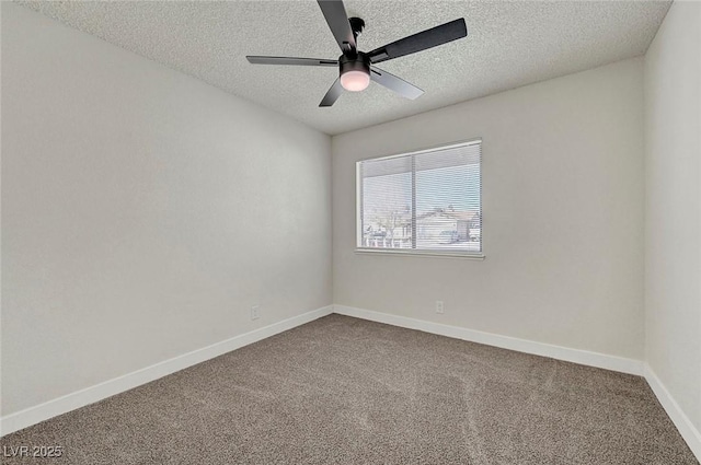 carpeted spare room with ceiling fan and a textured ceiling