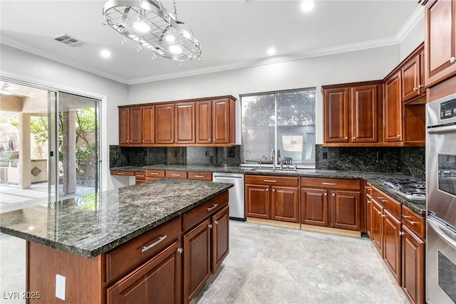 kitchen featuring stainless steel appliances, a center island, dark stone countertops, pendant lighting, and crown molding