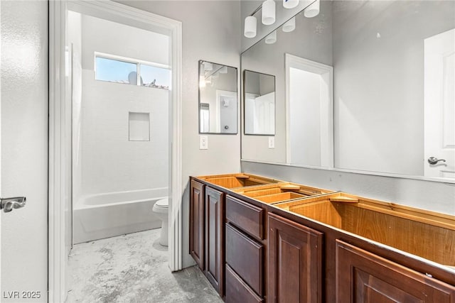 full bathroom featuring vanity, shower / washtub combination, and toilet