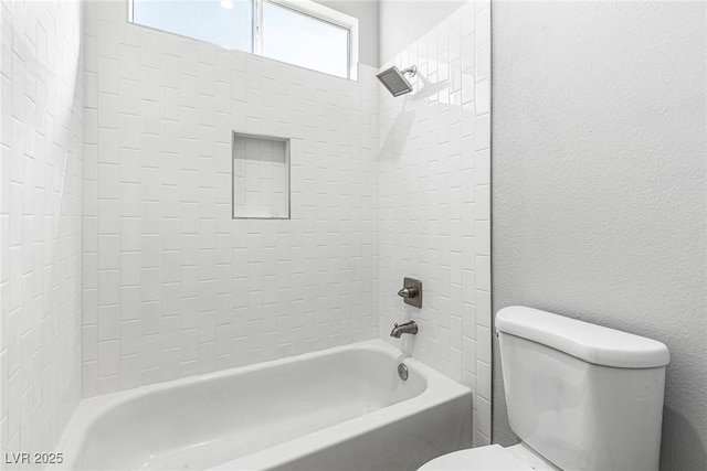 bathroom featuring  shower combination and toilet