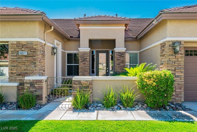 entrance to property featuring a garage