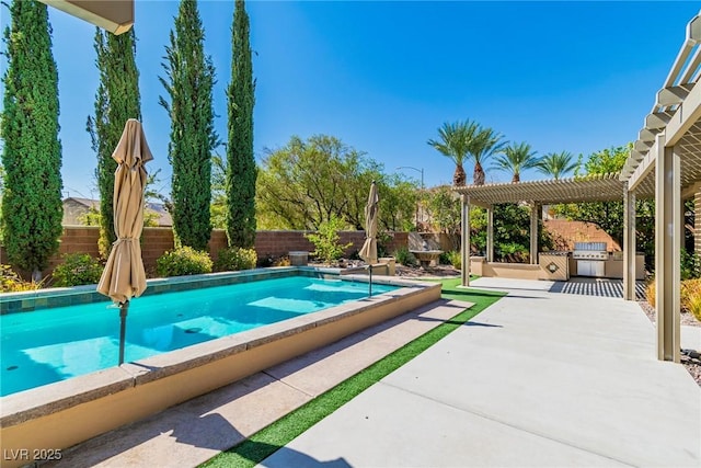 view of swimming pool featuring exterior kitchen, a pergola, and a patio area