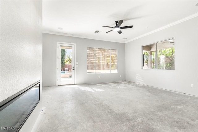 unfurnished room with ceiling fan and ornamental molding