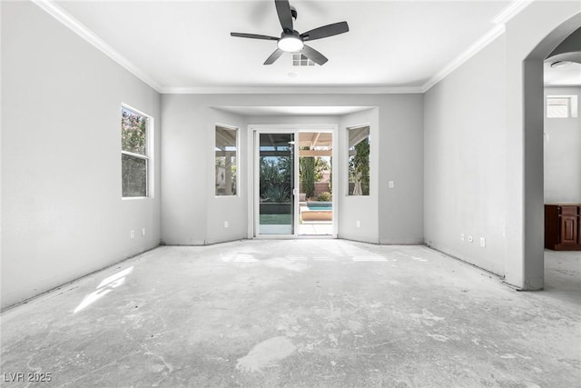 spare room featuring ceiling fan, ornamental molding, and plenty of natural light