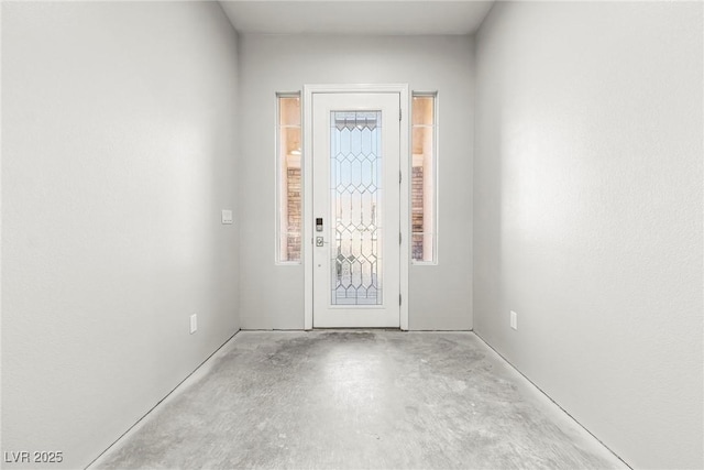 interior space featuring concrete flooring