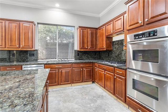 kitchen featuring backsplash, stainless steel appliances, dark stone countertops, and crown molding