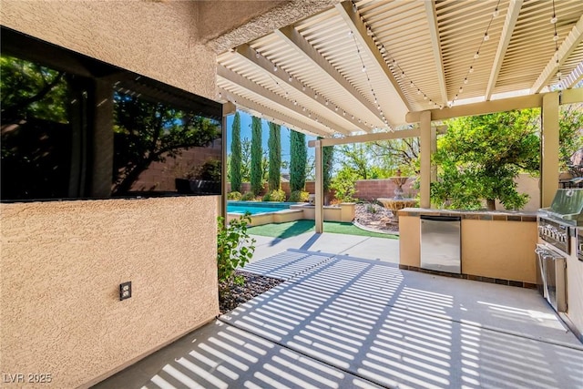 view of patio featuring an outdoor kitchen, exterior bar, and a pergola